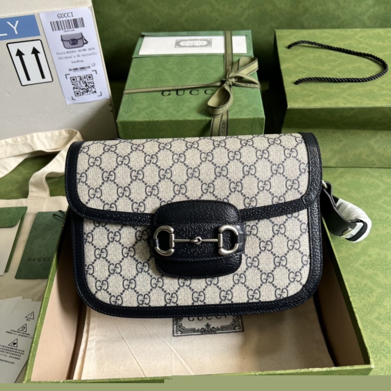 G*u*i clutch bags